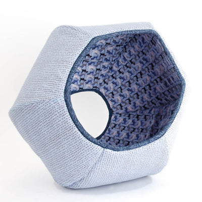 This Cat Ball® cat bed is made with blue fabrics, and the lining is a repeating cat design laid out in a stripe. These high-quality fabrics are 100% cotton.