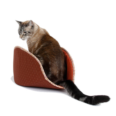 A 17-pound cat inside our jumbo-size CAT CANOE modern kitty bed. Designed for big kitties, this bed is made with brick red and terra cotta-colored cotton over foam panels. Made in the USA, ready to ship.