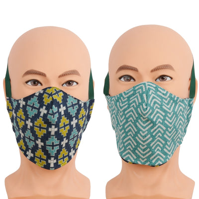 This reversible face mask is made with coordinating geometric print fabrics in navy, turquoise, and aqua. Three-layer cotton mask with filter pocket, nose wire, and different wearing options. Made in USA. 