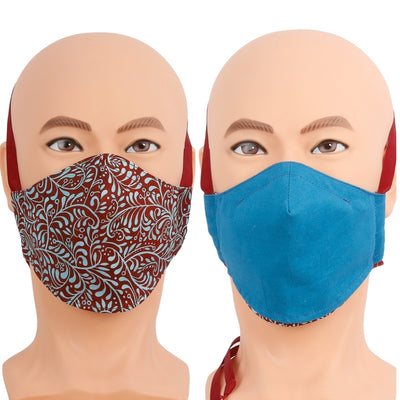 Reversible face mask in a red and turquoise blue floral print, the reverse is solid turquoise. Triple layer cotton fabric mask with filter pocket and nose wire. Adjustable behind the head band to keep the pressure off of your ears, or adjustable ear loops. Made in USA.