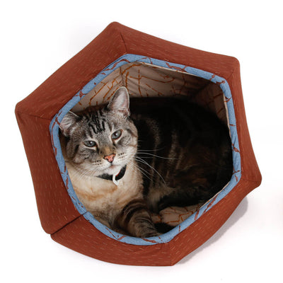 A Siamese/Angora mix cat curls up inside the Cat Ball® cat bed. This cat weighs 17 pounds and is able to use our six-paneled modern cat cave bed comfortably. 