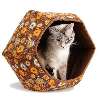 We've used fall colors to make this Cat Ball® cat bed, a 100% cotton medallion print in blues, browns, oranges, and yellows. Our six-panel, cave-style pet bed has inner flexible foam panels and two openings and is made in the USA by a small business.  