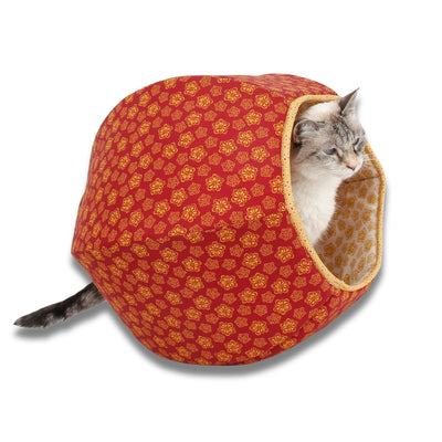 This Cat Ball® cat bed is made with a floral pattern in red and yellow with a white lining.  Our innovative cat cave bed fits cats to about 18 pounds, made in USA. 