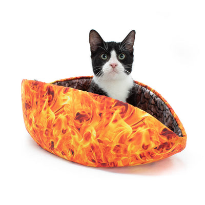 Cat Canoe® pet bed is made with digitally printed fabrics to look like realistic flames and lined with stones. Our modern cat bed is long and narrow with high sides. This taco-shaped cat bed has flexible inner foam panels that will wrap around your sleeping pet, creating a snuggly nest. Photo by Kate Benjamin. 