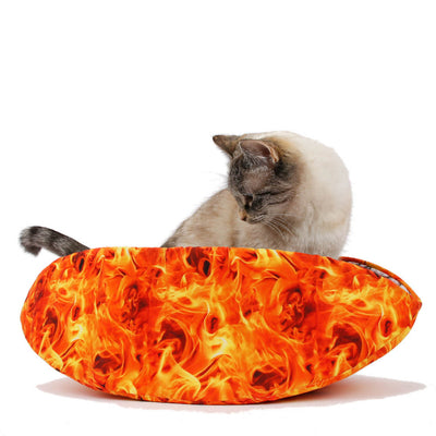 Cat Canoe® pet bed is made with digitally printed fabrics to look like realistic flames and lined with stones. Our modern cat bed is long and narrow with high sides. This taco-shaped cat bed has flexible inner foam panels that will wrap around your sleeping pet, creating a snuggly nest. Made in the USA.