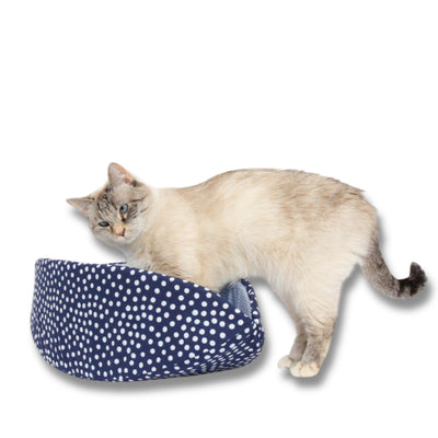 We've used coordinating cotton fabrics in shades of blue and light blue to create our Indigo Dots Cat Canoe® Our innovative modern cat bed is long and narrow with high sides, some people say it looks like a taco. Cats who like to sleep in boxes often like this flexible and washable cat bed. Made in the USA.