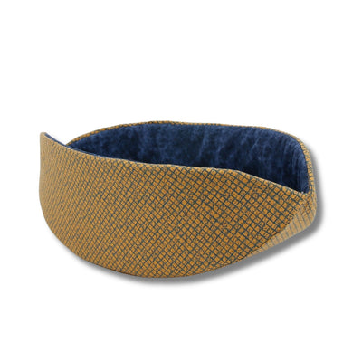 The Cat Canoe® kitty bed made in a dark yellow and navy blue fabric with a grid pattern.