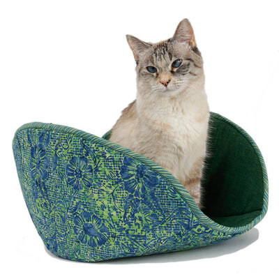 Our newly redesigned jumbo Cat Canoe® is made here in a delightful green and blue floral batik. Cotton fabrics over foam. The cat model weighs about 7 pounds.