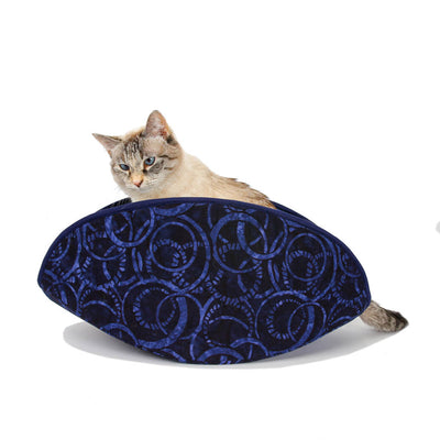 Our new, updated jumbo-size cat Canoe® is made here with a navy blue batik. This bed was designed for pets over 18 pounds, or cats who share a bed, but the cat in this photo only weighs 7 pounds. 