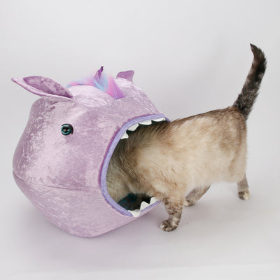 The lavender unicorn Cat Ball cat bed with rainbow mane is a covered cat bed with two openings