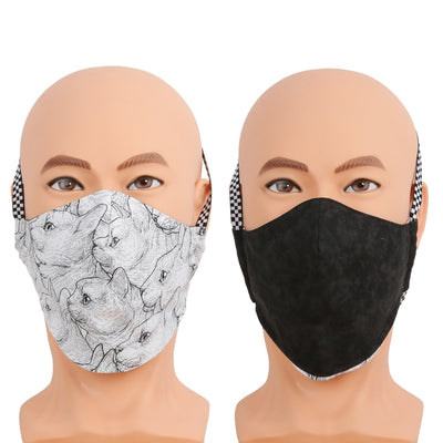 This reversible face mask is made with a black and white cat fabric on one side and a solid black on the other. ​Three-layer cotton mask with filter pocket, nose wire, and different wearing options. Made in USA. 