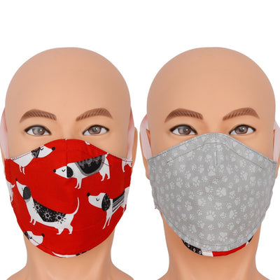 Reversible face mask in a cute novelty fabric with Dachshund dogs wearing swearers. This red face mask flips over to a dog paw print in grey. Triple layer cotton fabric mask with filter pocket and nose wire. Adjustable behind the head band to keep the pressure off of your ears, or adjustable ear loops. Made in USA.